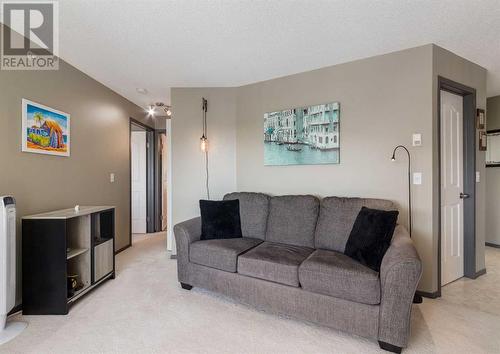 410, 6000 Somervale Court Sw, Calgary, AB - Indoor Photo Showing Living Room