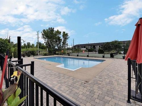 Pool - 302-4971 Av. Eliot, Laval (Chomedey), QC - Outdoor With In Ground Pool