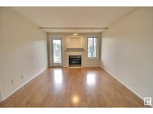 #316 237 Youville Dr Nw, Edmonton, AB - Indoor Photo Showing Living Room With Fireplace