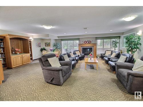 #316 237 Youville Dr Nw, Edmonton, AB - Indoor Photo Showing Living Room With Fireplace