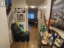 Hallway featuring a textured ceiling and dark hardwood / wood-style flooring - 