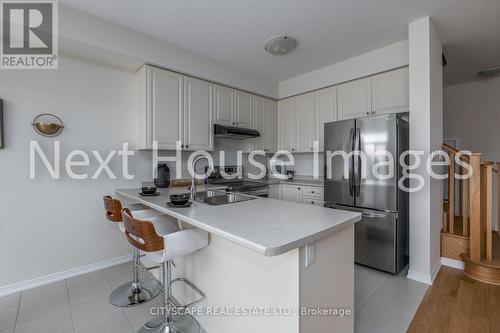 12 - 8317 Mulberry Drive, Niagara Falls, ON - Indoor Photo Showing Kitchen With Double Sink