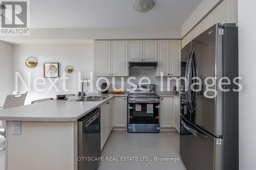 12 - 8317 Mulberry Drive, Niagara Falls, ON - Indoor Photo Showing Kitchen With Double Sink