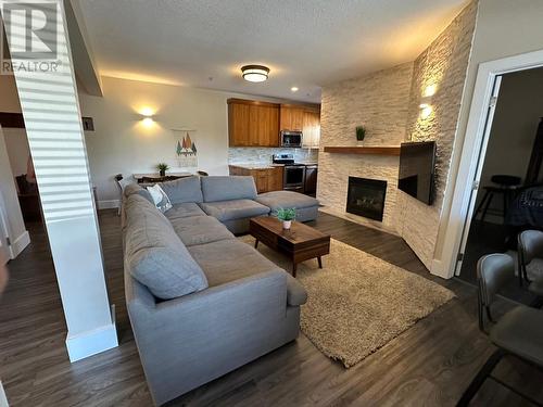 5343 Ski Hill  Road Unit# 213, Fernie, BC - Indoor Photo Showing Living Room With Fireplace