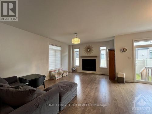 1039 Hydrangea Avenue, Ottawa, ON - Indoor Photo Showing Living Room With Fireplace