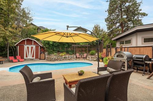 677 Drummond Court, Kelowna, BC - Outdoor With In Ground Pool With Deck Patio Veranda