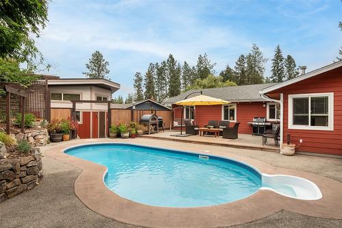 677 Drummond Court, Kelowna, BC - Outdoor With In Ground Pool With Deck Patio Veranda With Backyard