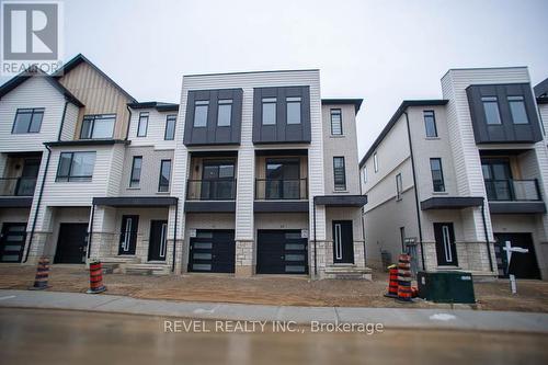 40 - 55 Tom Brown Drive, Brant, ON - Outdoor With Balcony With Facade