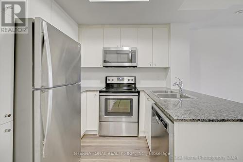 Th9 - 145 Long Branch Avenue, Toronto, ON - Indoor Photo Showing Kitchen With Stainless Steel Kitchen With Double Sink