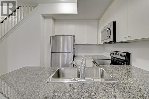 Th9 - 145 Long Branch Avenue, Toronto, ON - Indoor Photo Showing Kitchen With Stainless Steel Kitchen With Double Sink With Upgraded Kitchen