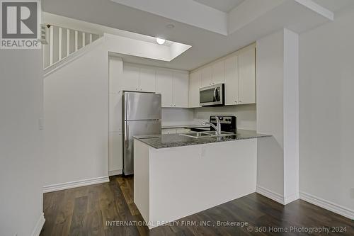 Th9 - 145 Long Branch Avenue, Toronto, ON - Indoor Photo Showing Kitchen With Double Sink