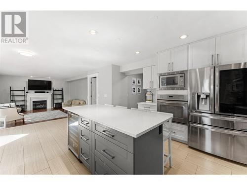 5327 Hedeman Court, Kelowna, BC - Indoor Photo Showing Kitchen With Fireplace