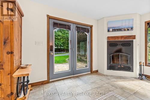 1403A Everett Lane, South Frontenac, ON - Indoor With Fireplace