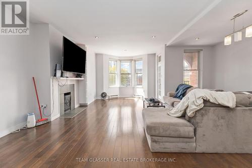 303 - 440 Wellington Street, London, ON - Indoor Photo Showing Living Room With Fireplace