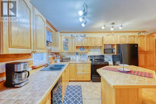 409 Red Cedar Point Road, Stone Mills, ON - Indoor Photo Showing Kitchen With Double Sink