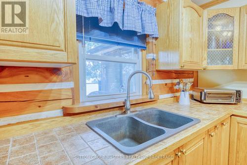 409 Red Cedar Point Road, Stone Mills, ON - Indoor Photo Showing Kitchen With Double Sink