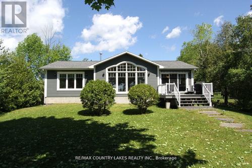 275 Mcguire Beach Road, Kawartha Lakes, ON - Outdoor With Deck Patio Veranda With Facade