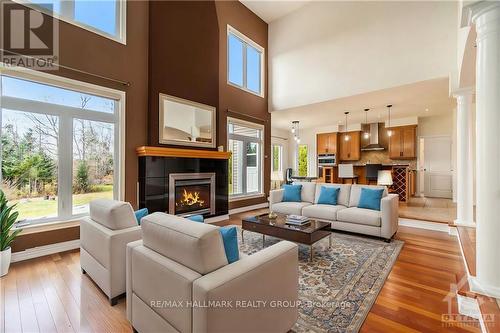 4785 Whispering Willow Drive, Ottawa, ON - Indoor Photo Showing Living Room With Fireplace