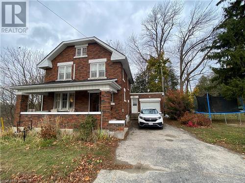 View of front property featuring a porch and a trampoline - 76 10Th Street, Hanover, ON - Outdoor With Deck Patio Veranda