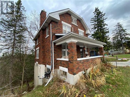 View of side of property featuring covered porch and ac unit - 76 10Th Street, Hanover, ON - Outdoor