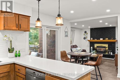 35 Pooles Road, Springwater, ON - Indoor Photo Showing Kitchen With Fireplace