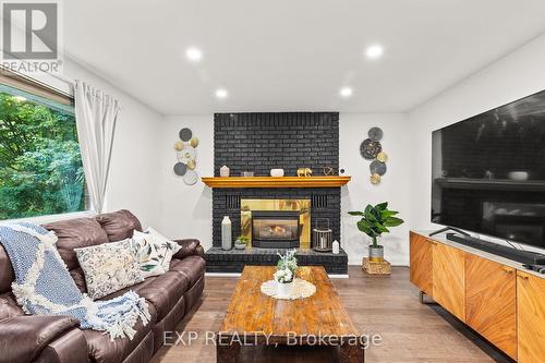 35 Pooles Road, Springwater, ON - Indoor Photo Showing Living Room With Fireplace