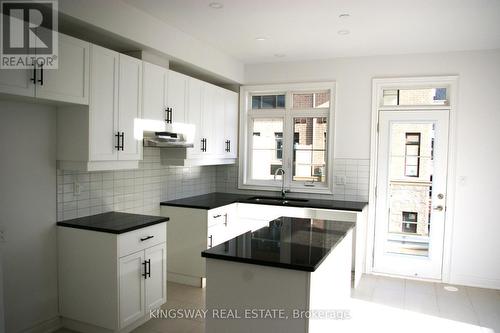 7 - 2123 Lillykin Street, Oakville, ON - Indoor Photo Showing Kitchen With Double Sink