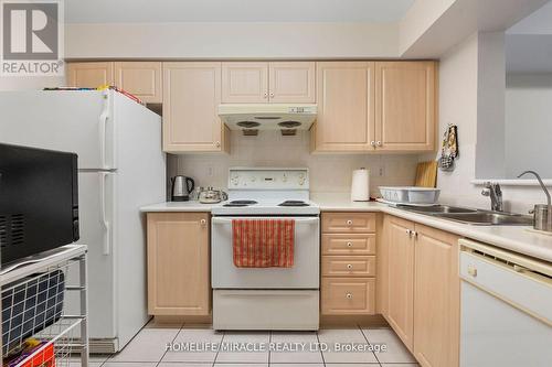 802 - 5039 Finch Avenue E, Toronto, ON - Indoor Photo Showing Kitchen With Double Sink