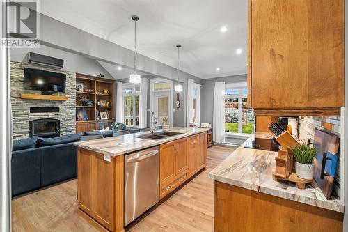 8 Nicholas Place, Paradise, NL - Indoor Photo Showing Kitchen With Fireplace With Double Sink