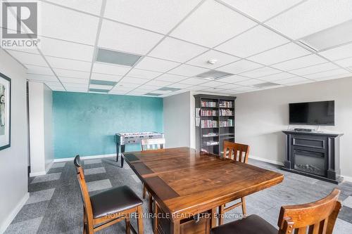 1703 - 15 Kensington Road, Brampton, ON - Indoor Photo Showing Dining Room With Fireplace