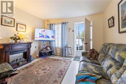 50 Boucher Street, Rogersville, NB - Indoor Photo Showing Living Room With Fireplace