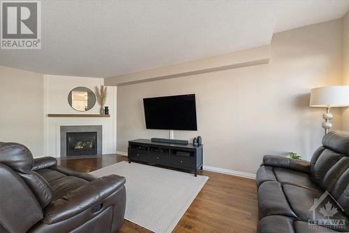 235 Rolling Meadow Crescent, Ottawa, ON - Indoor Photo Showing Living Room With Fireplace