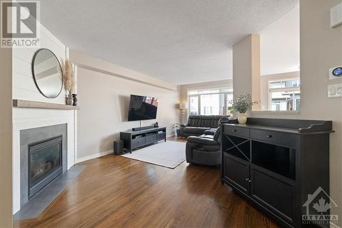 235 Rolling Meadow Crescent, Ottawa, ON - Indoor Photo Showing Living Room With Fireplace