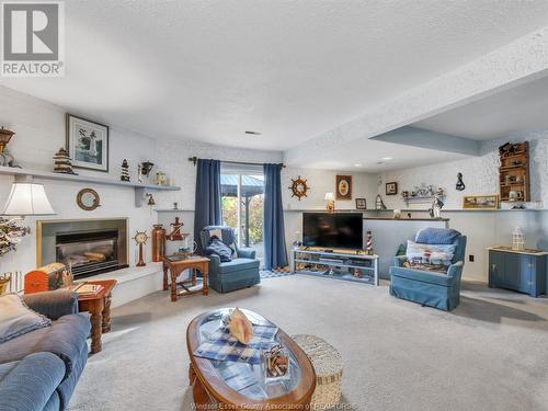 1219 Nottingham, Kingsville, ON - Indoor Photo Showing Living Room With Fireplace