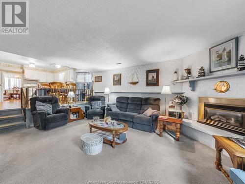 1219 Nottingham, Kingsville, ON - Indoor Photo Showing Living Room With Fireplace