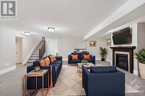 This photo has been virtually staged. - 740 Cartographe Street, Ottawa, ON - Indoor Photo Showing Living Room With Fireplace