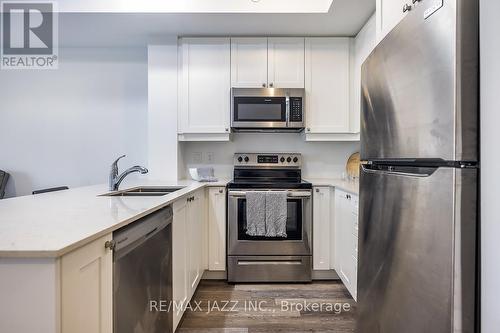 126 - 50 Lakebreeze Drive, Clarington (Newcastle), ON - Indoor Photo Showing Kitchen With Stainless Steel Kitchen With Double Sink