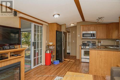 486 Cty 18-3Park Meadow Lane, Prince Edward County (Athol), ON - Indoor Photo Showing Kitchen With Fireplace