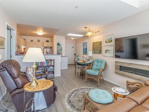 301-750 Memorial Ave, Qualicum Beach, BC - Indoor Photo Showing Living Room With Fireplace