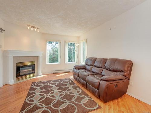 308-490 Marsett Pl, Saanich, BC - Indoor Photo Showing Living Room With Fireplace