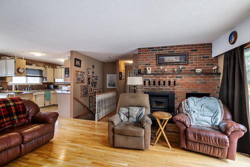 15911 Trask Road, Lake Country, BC - Indoor Photo Showing Living Room With Fireplace