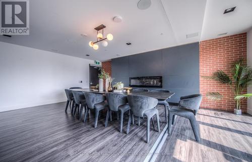 1704 - 15 Wellington Street, Kitchener, ON - Indoor Photo Showing Dining Room With Fireplace