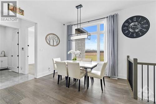 Dining area overlooking the expansive backyard - 13708 County Rd 15 Road, Merrickville, ON - Indoor Photo Showing Dining Room