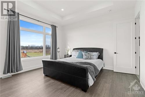 Primary bdrm with large windows and continuing with the high celings - 13708 County Rd 15 Road, Merrickville, ON - Indoor Photo Showing Bedroom