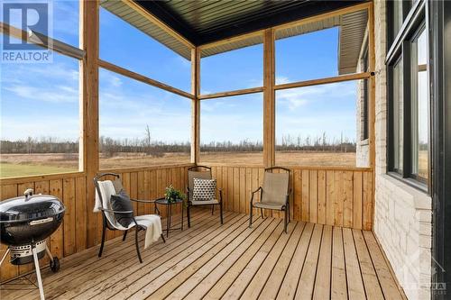 Spacious 3 season sunroom to enjoy coffee while watching sunsets!! - 13708 County Rd 15 Road, Merrickville, ON - Outdoor With Deck Patio Veranda With View With Exterior