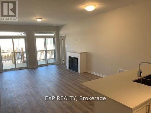 28 - 17 Lakewood Crescent, Kawartha Lakes, ON - Indoor Photo Showing Other Room With Fireplace