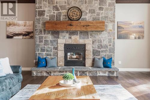 4245 Delta Road, Severn, ON - Indoor Photo Showing Living Room With Fireplace