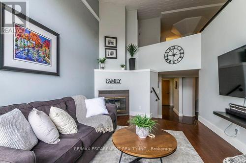 405 - 50 Main Street, Hamilton, ON - Indoor Photo Showing Living Room With Fireplace