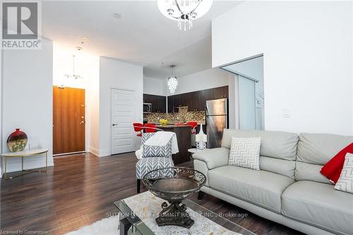 102 - 215 Queen Street, Brampton, ON - Indoor Photo Showing Living Room