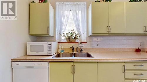 304 2925 14Th Avenue, Regina, SK - Indoor Photo Showing Kitchen With Double Sink